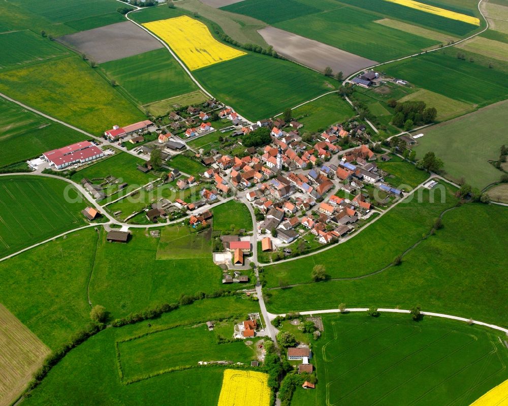 Binzwangen from above - Agricultural land and field boundaries surround the settlement area of the village in Binzwangen in the state Bavaria, Germany