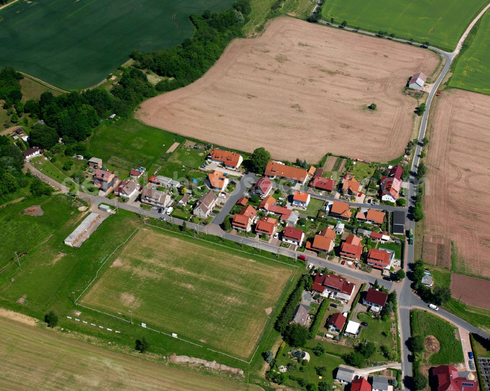 Aerial photograph Birkenfelde - Agricultural land and field boundaries surround the settlement area of the village in Birkenfelde in the state Thuringia, Germany