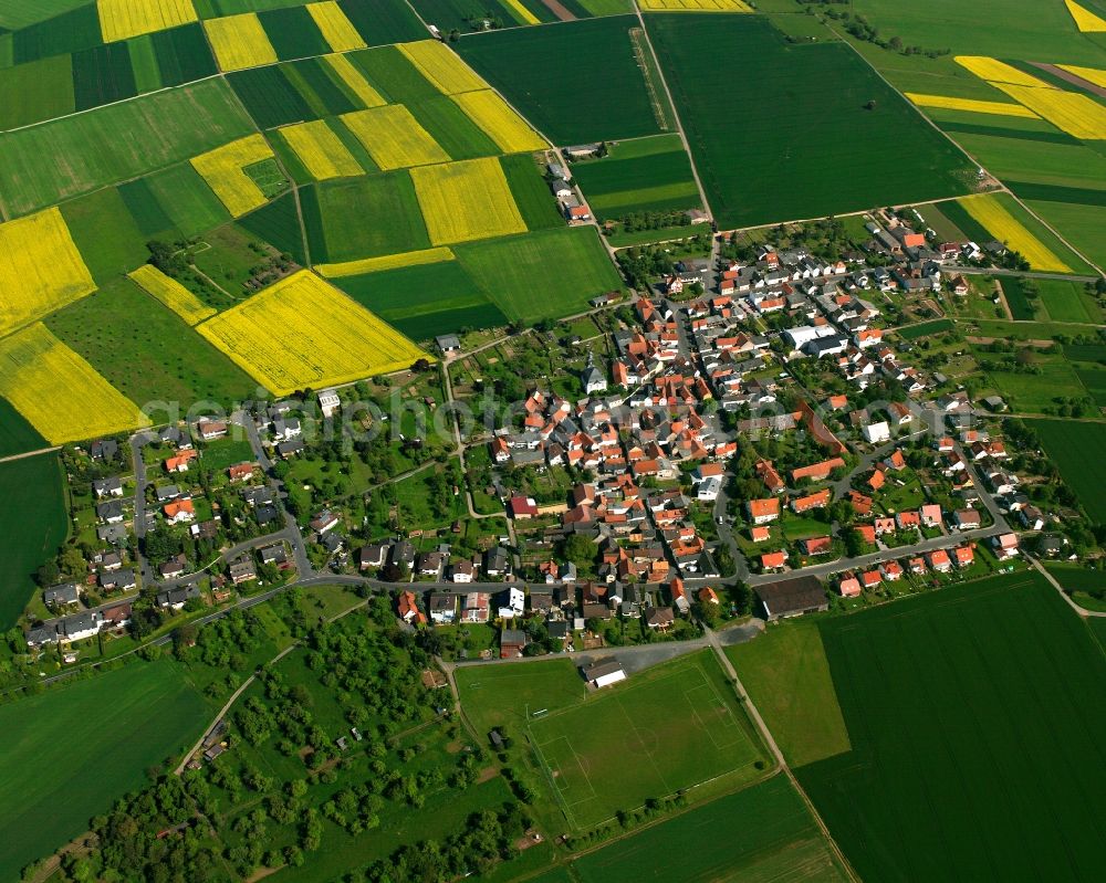 Birklar from the bird's eye view: Agricultural land and field boundaries surround the settlement area of the village in Birklar in the state Hesse, Germany