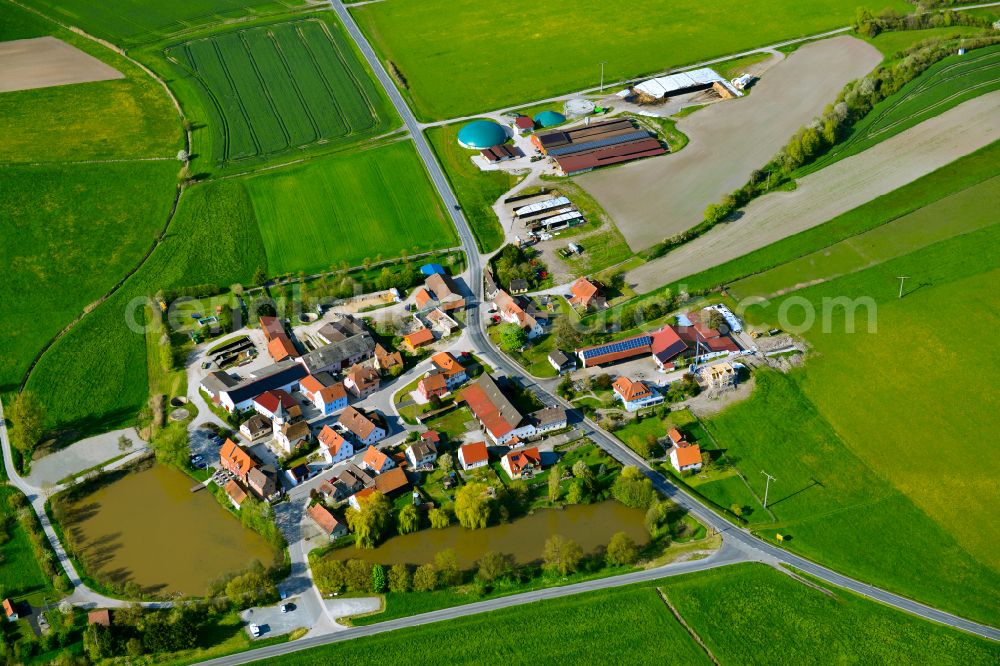 Aerial image Birklingen - Agricultural land and field boundaries surround the settlement area of the village in Birklingen in the state Bavaria, Germany