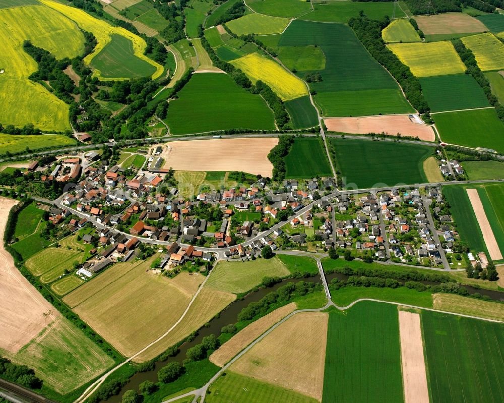 Aerial image Blankenheim - Agricultural land and field boundaries surround the settlement area of the village in Blankenheim in the state Hesse, Germany