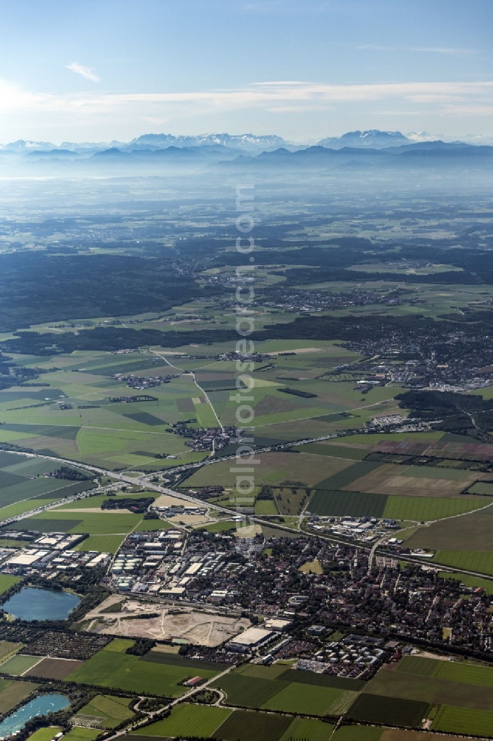 Feldkirchen from the bird's eye view: Agricultural land and field boundaries surround the settlement area of the village with Blick in die Berge in Feldkirchen in the state Bavaria, Germany