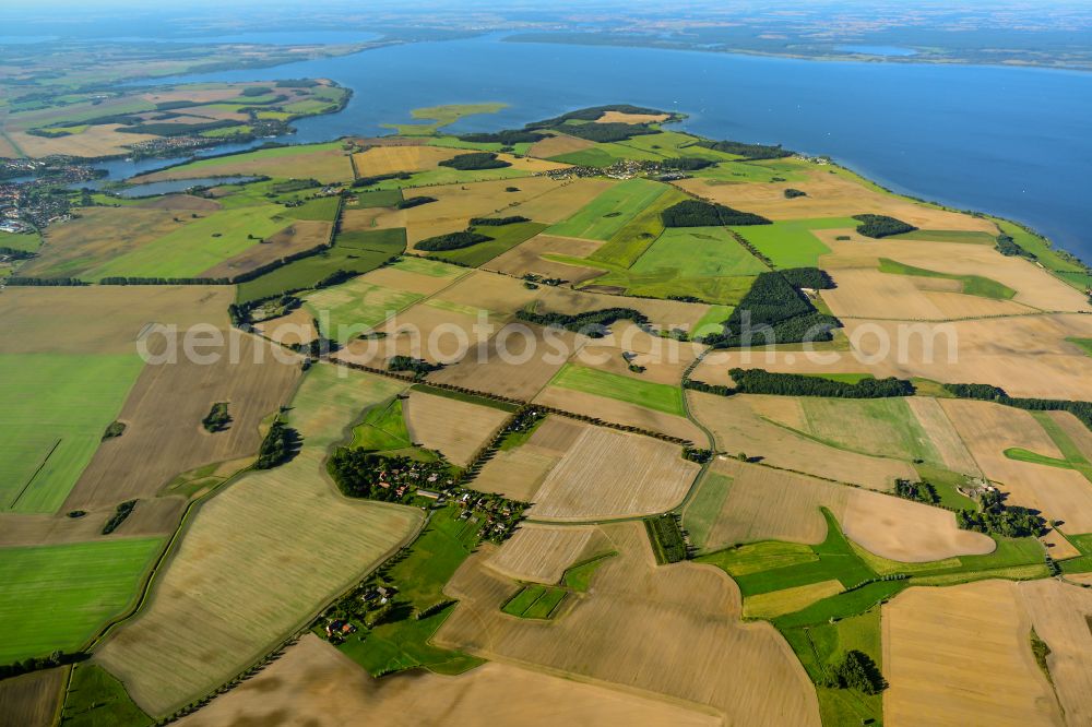 Solzow from above - Agricultural land and field boundaries surround the settlement area of the village with Blick auf die Mueritz in Solzow at Mueritz in the state Mecklenburg - Western Pomerania, Germany