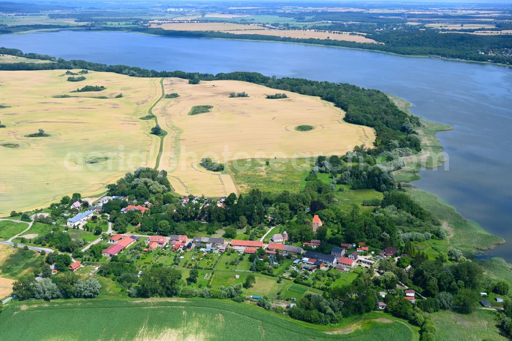 Bülow from above - Agricultural land and field boundaries surround the settlement area of the village in Bülow in the state Mecklenburg - Western Pomerania, Germany