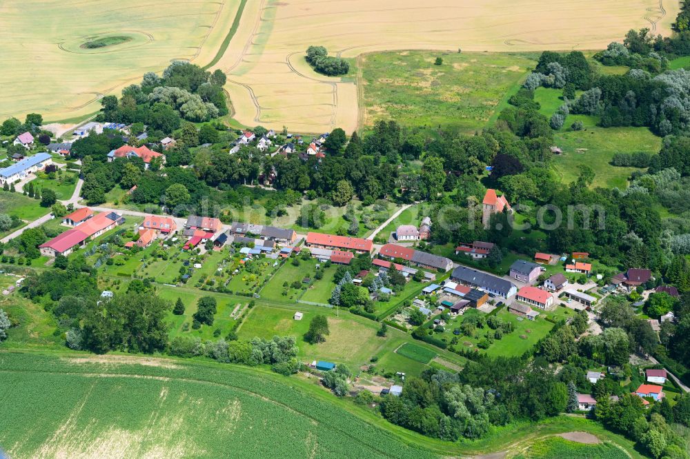 Bülow from the bird's eye view: Agricultural land and field boundaries surround the settlement area of the village in Bülow in the state Mecklenburg - Western Pomerania, Germany