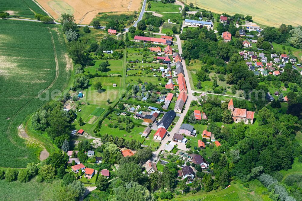 Bülow from the bird's eye view: Agricultural land and field boundaries surround the settlement area of the village in Bülow in the state Mecklenburg - Western Pomerania, Germany