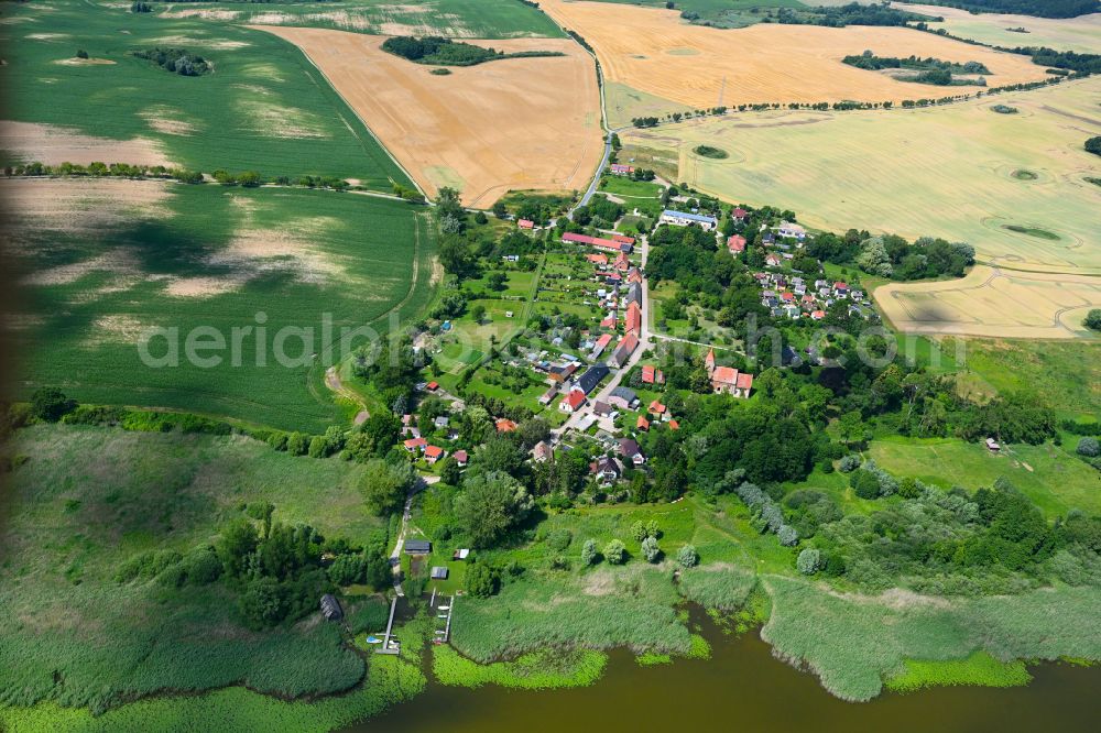 Aerial image Bülow - Agricultural land and field boundaries surround the settlement area of the village in Bülow in the state Mecklenburg - Western Pomerania, Germany