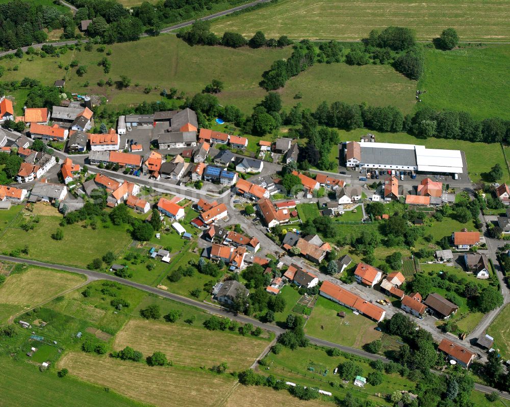 Aerial photograph Bobenhausen - Agricultural land and field boundaries surround the settlement area of the village in Bobenhausen in the state Hesse, Germany