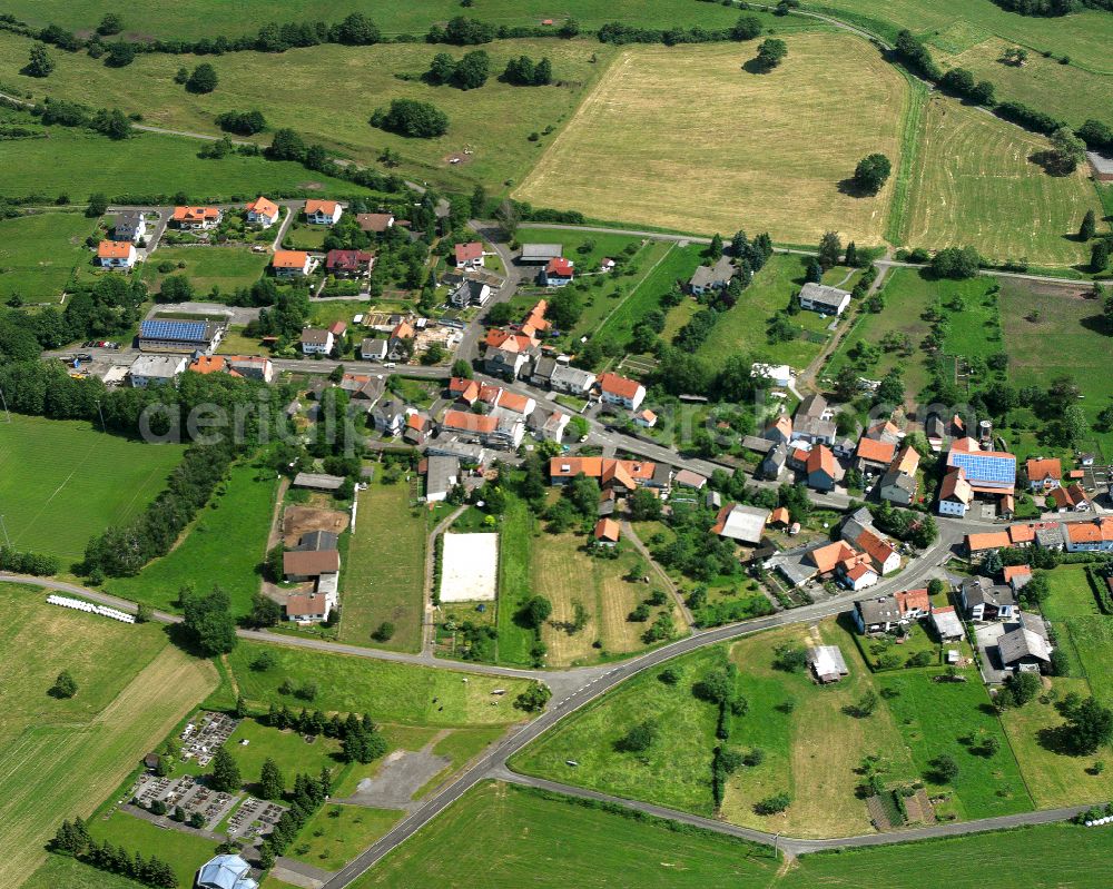 Bobenhausen from the bird's eye view: Agricultural land and field boundaries surround the settlement area of the village in Bobenhausen in the state Hesse, Germany