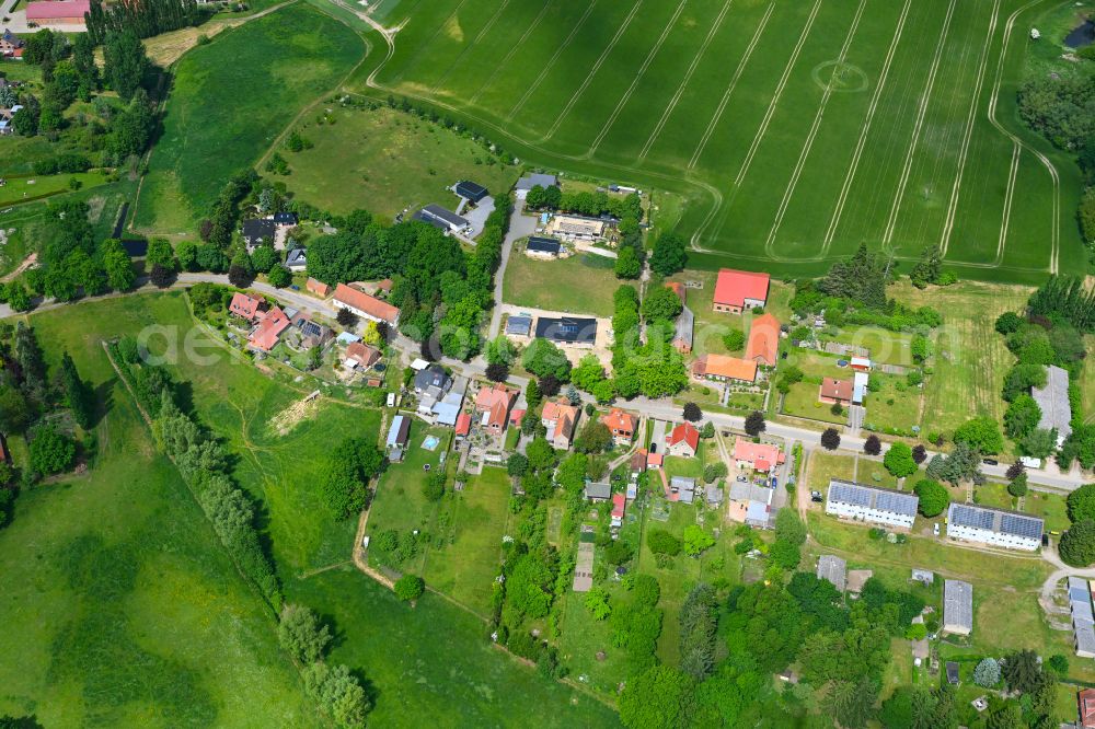 Aerial photograph Bobzin - Agricultural land and field boundaries surround the settlement area of the village in Bobzin in the state Mecklenburg - Western Pomerania, Germany