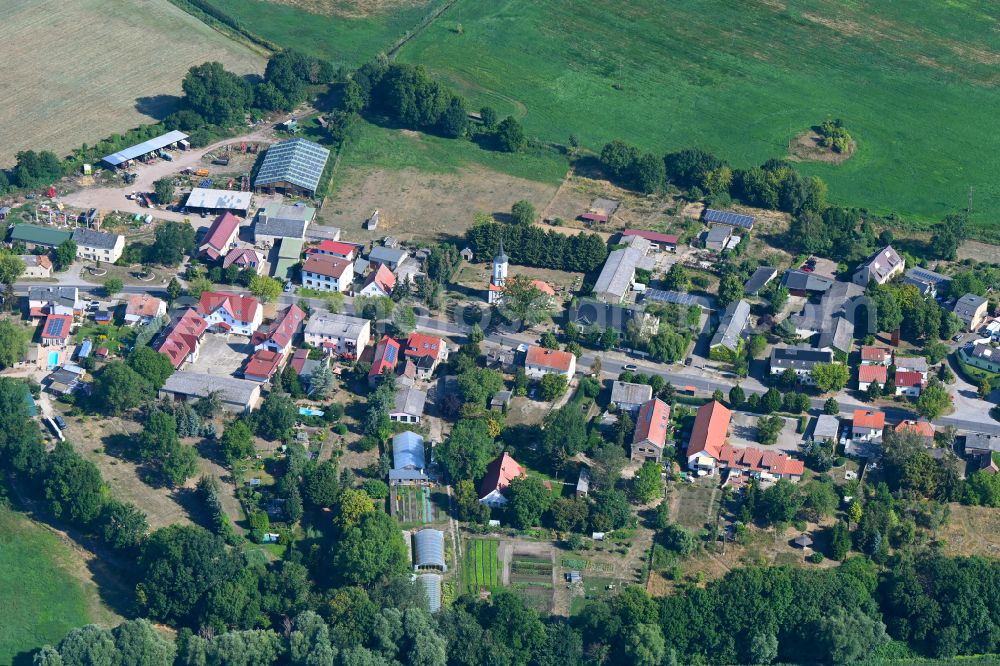 Aerial image Bochow - Agricultural land and field boundaries surround the settlement area of the village in Bochow in the state Brandenburg, Germany