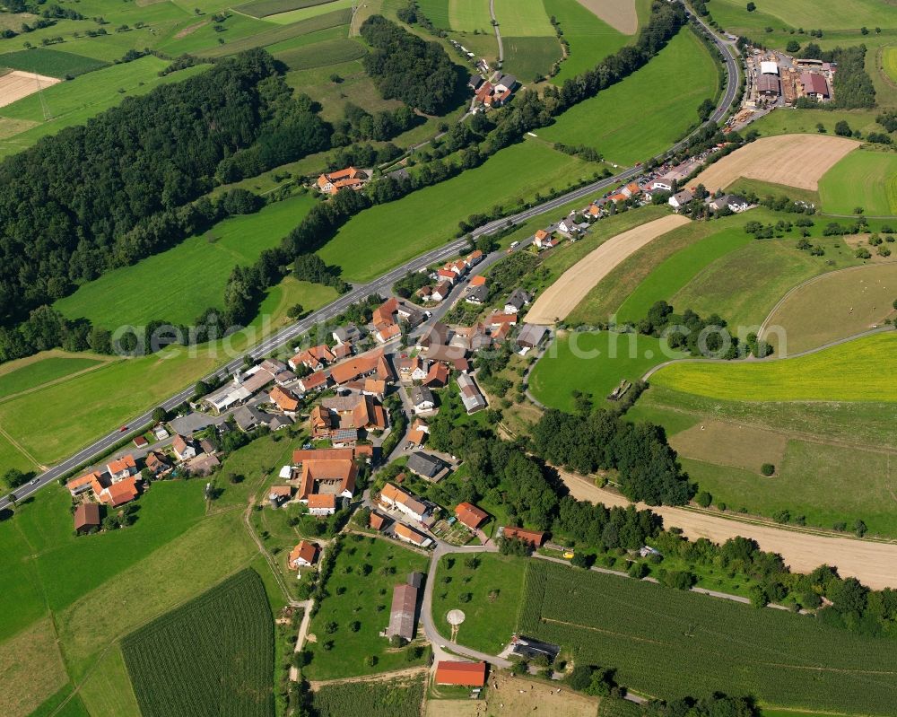 Aerial photograph Bockenrod - Agricultural land and field boundaries surround the settlement area of the village in Bockenrod in the state Hesse, Germany