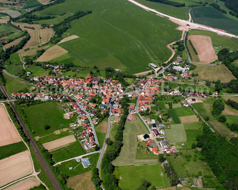 Bodenrode from the bird's eye view: Agricultural land and field boundaries surround the settlement area of the village in Bodenrode in the state Thuringia, Germany