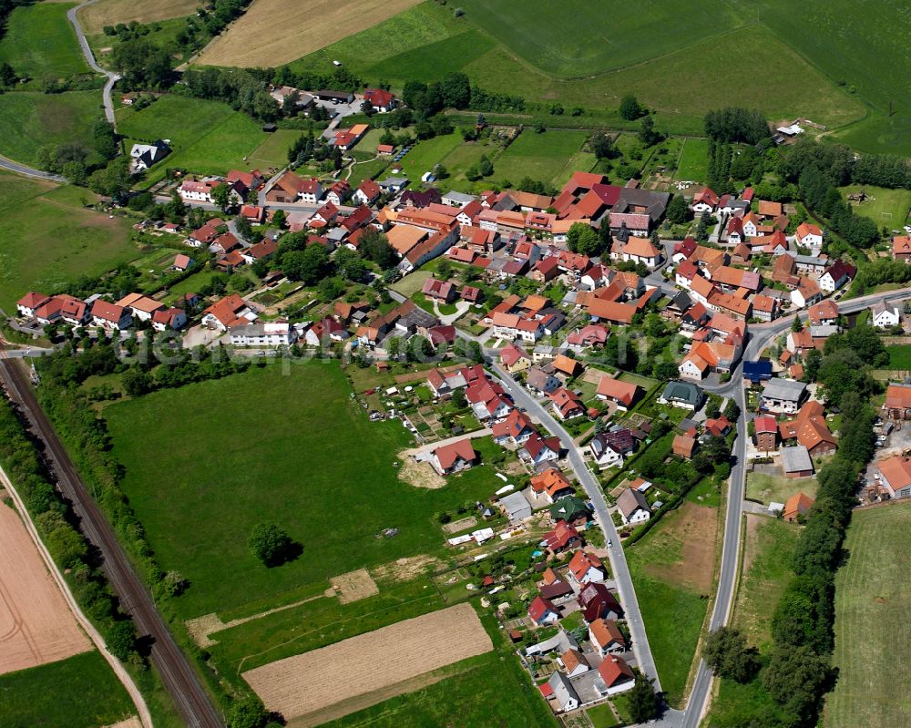 Aerial image Bodenrode - Agricultural land and field boundaries surround the settlement area of the village in Bodenrode in the state Thuringia, Germany