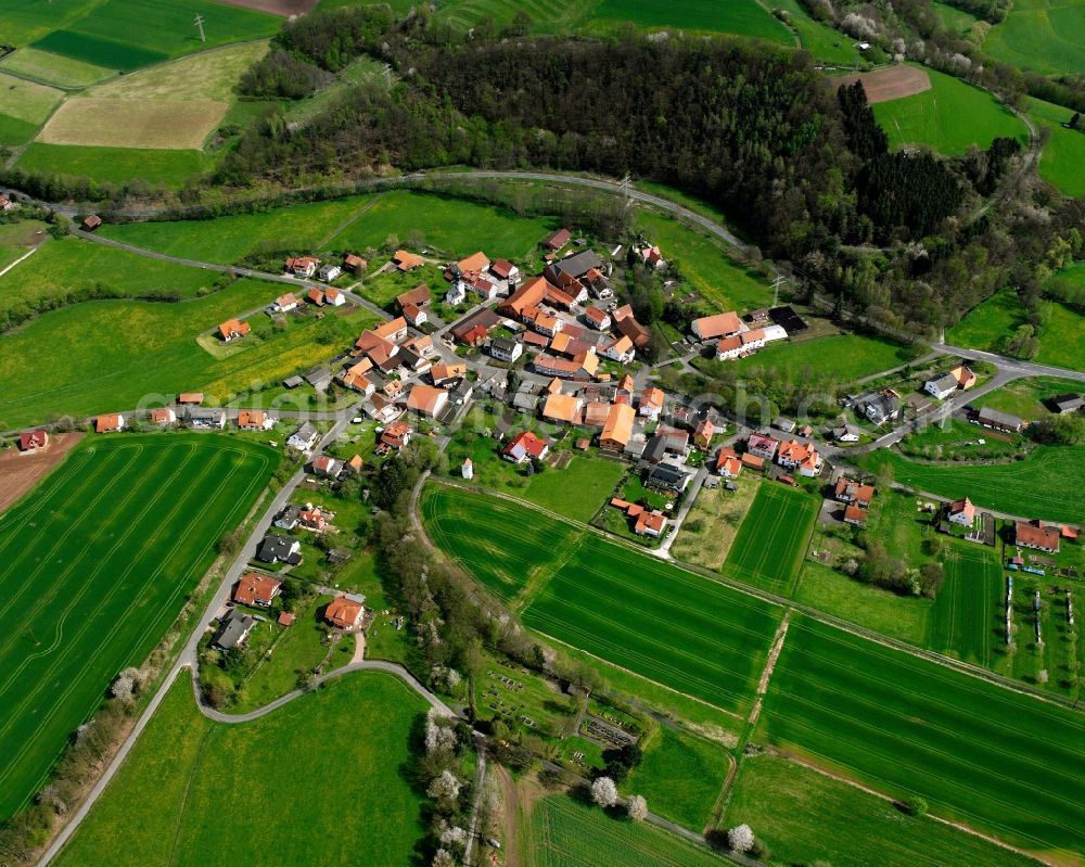 Bodes from the bird's eye view: Agricultural land and field boundaries surround the settlement area of the village in Bodes in the state Hesse, Germany