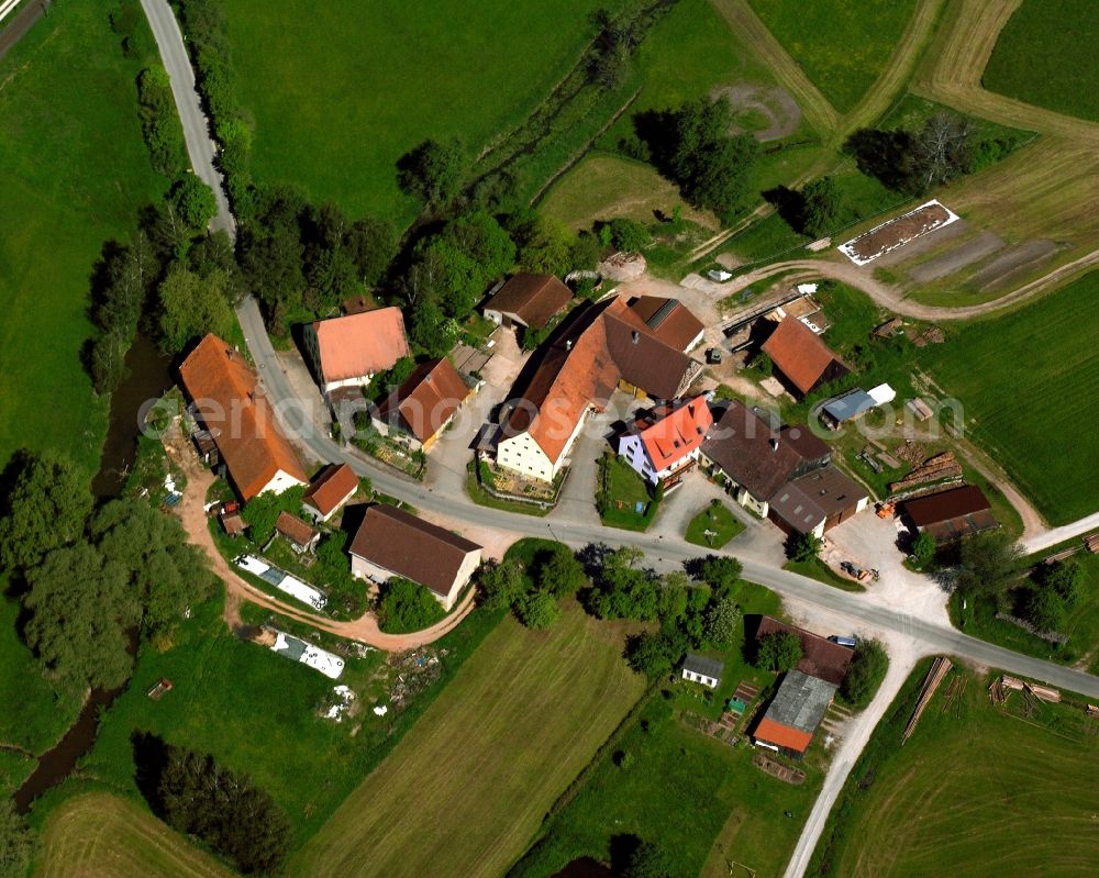 Bonlanden from above - Agricultural land and field boundaries surround the settlement area of the village in Bonlanden in the state Bavaria, Germany