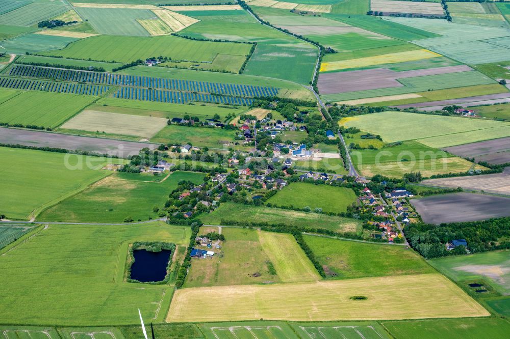 Aerial photograph Bosbüll - Agricultural land and field boundaries surround the settlement area of the village on street Hauptstrasse in Bosbuell in the state Schleswig-Holstein, Germany