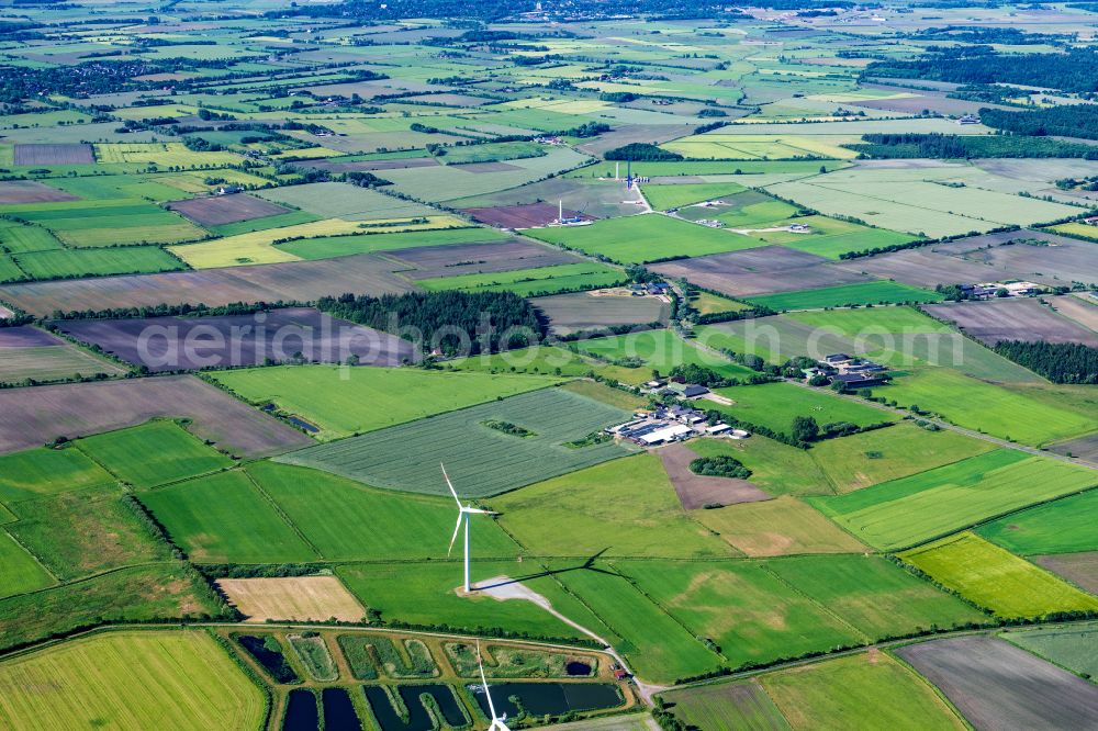 Boverstedt from above - Agricultural land and field boundaries surround the settlement area of the village in Boverstedt in the state Schleswig-Holstein, Germany