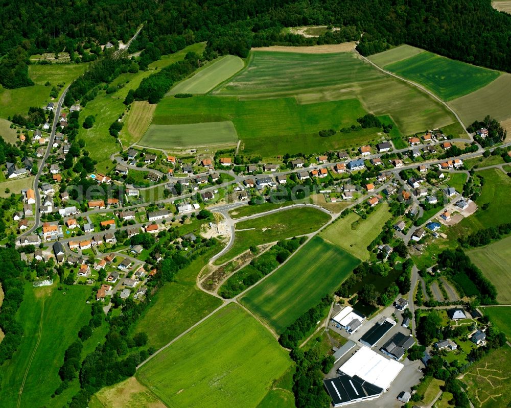 Aerial image Brücken - Agricultural land and field boundaries surround the settlement area of the village in Brücken in the state Rhineland-Palatinate, Germany