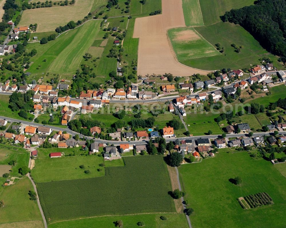 Breitenbrunn from the bird's eye view: Agricultural land and field boundaries surround the settlement area of the village in Breitenbrunn in the state Hesse, Germany