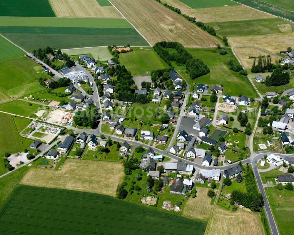 Bärenbach from the bird's eye view: Agricultural land and field boundaries surround the settlement area of the village in Bärenbach in the state Rhineland-Palatinate, Germany