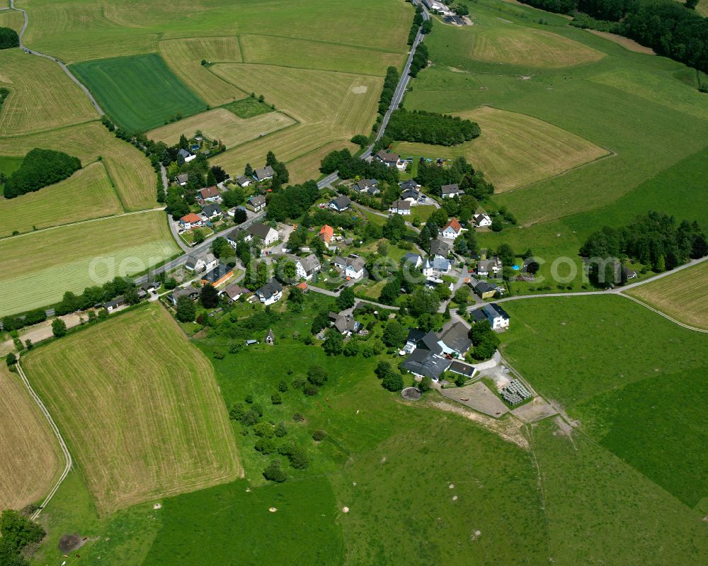 Aerial image Bürhausen - Agricultural land and field boundaries surround the settlement area of the village in Bürhausen in the state North Rhine-Westphalia, Germany