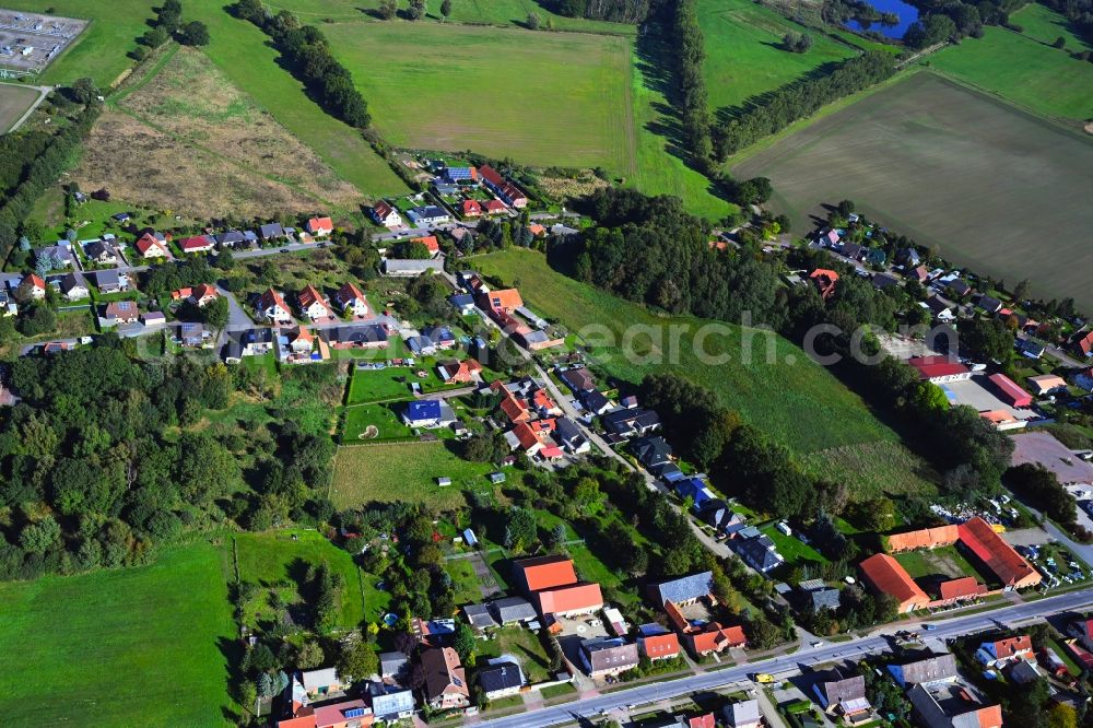 Brietz from above - Agricultural land and field boundaries surround the settlement area of the village in Brietz in the state Saxony-Anhalt, Germany