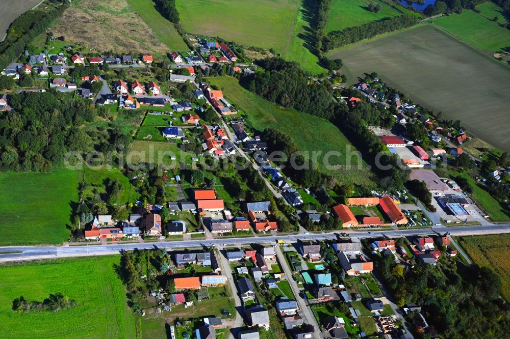 Brietz from the bird's eye view: Agricultural land and field boundaries surround the settlement area of the village in Brietz in the state Saxony-Anhalt, Germany