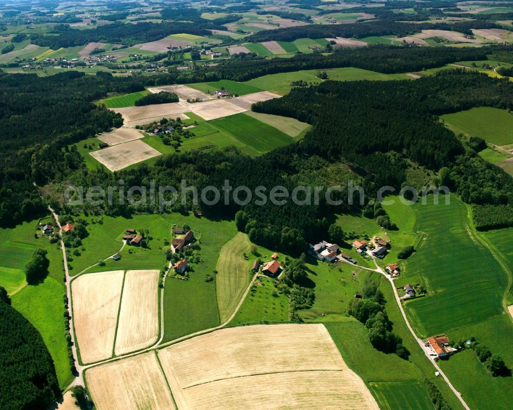 Brombach from above - Agricultural land and field boundaries surround the settlement area of the village in Brombach in the state Bavaria, Germany