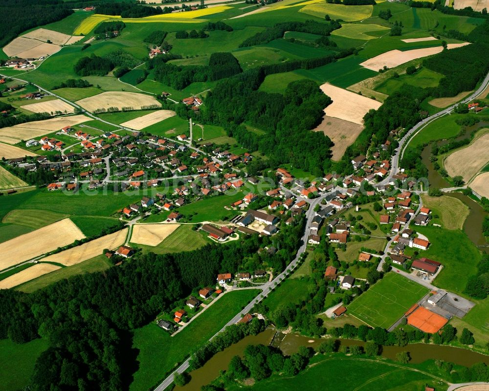 Aerial image Brombach - Agricultural land and field boundaries surround the settlement area of the village in Brombach in the state Bavaria, Germany