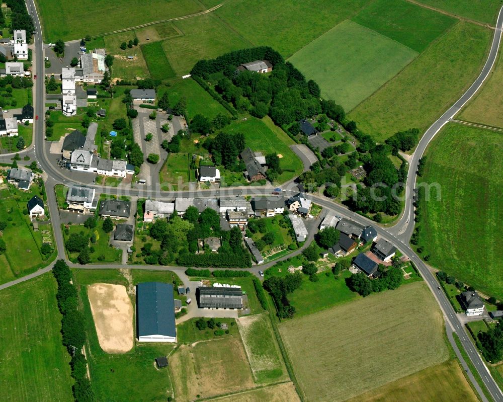 Bruchweiler from above - Agricultural land and field boundaries surround the settlement area of the village in Bruchweiler in the state Rhineland-Palatinate, Germany