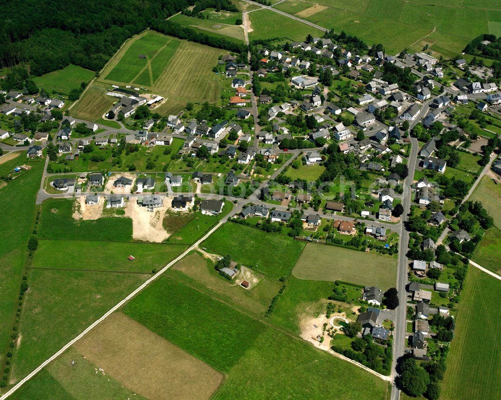 Bruchweiler from the bird's eye view: Agricultural land and field boundaries surround the settlement area of the village in Bruchweiler in the state Rhineland-Palatinate, Germany