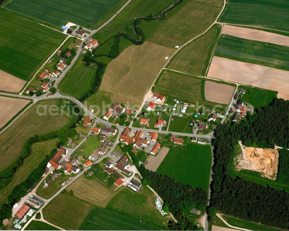 Aerial image Bruck - Agricultural land and field boundaries surround the settlement area of the village in Bruck in the state Bavaria, Germany