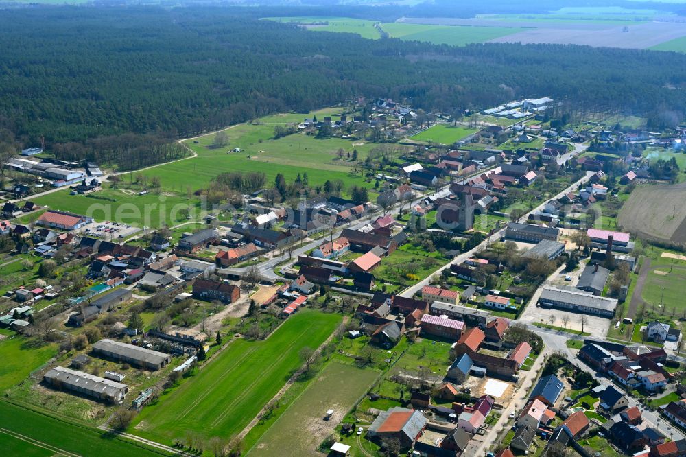 Brunau from above - Agricultural land and field boundaries surround the settlement area of the village in Brunau in the state Saxony-Anhalt, Germany