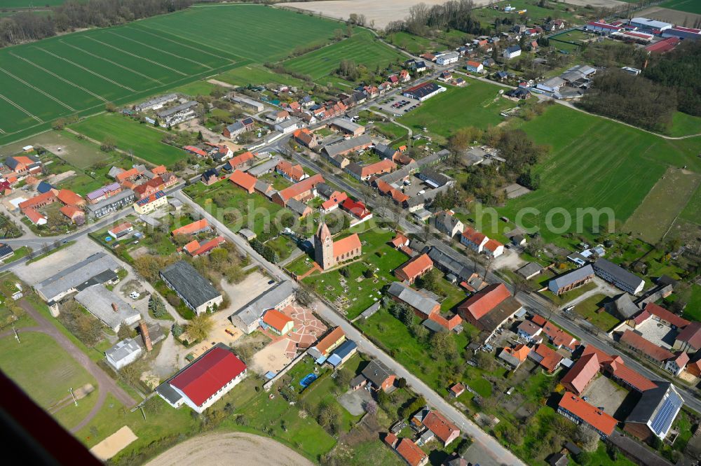 Brunau from above - Agricultural land and field boundaries surround the settlement area of the village in Brunau in the state Saxony-Anhalt, Germany