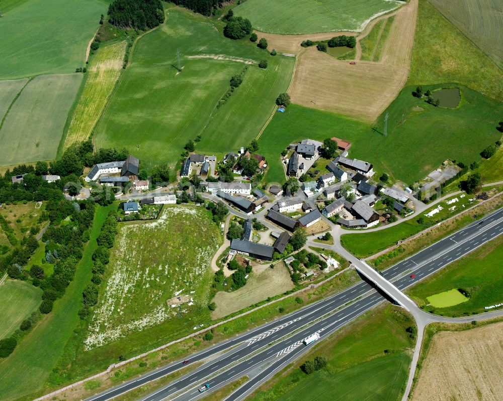 Brunn from the bird's eye view: Agricultural land and field boundaries surround the settlement area of the village in Brunn in the state Bavaria, Germany