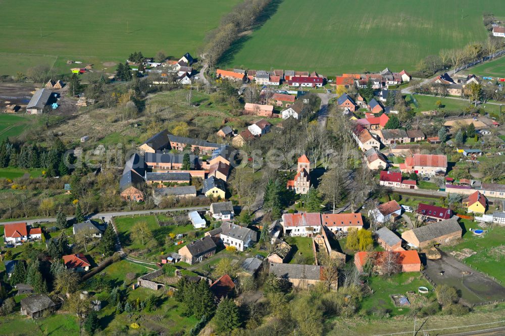 Aerial image Buberow - Agricultural land and field boundaries surround the settlement area of the village in Buberow in the state Brandenburg, Germany