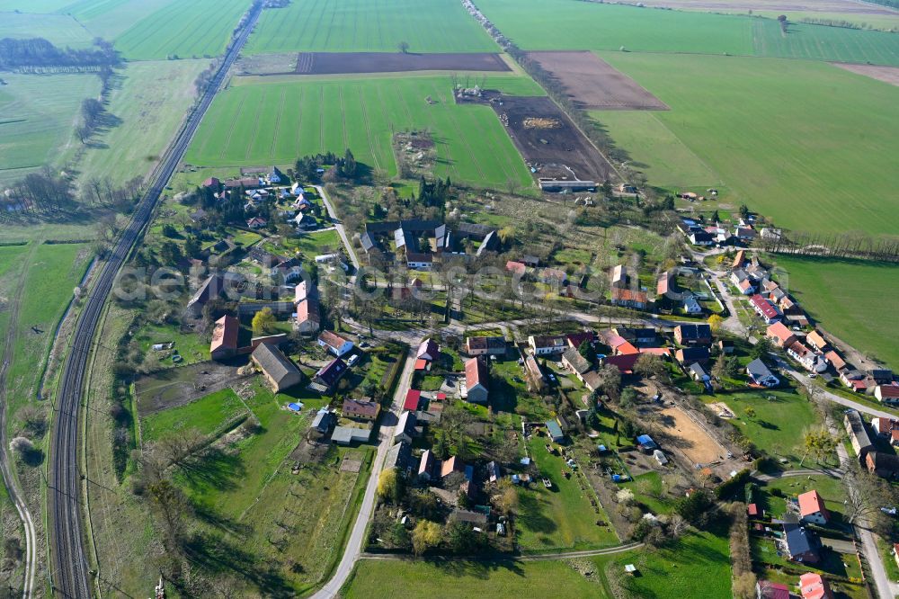 Aerial image Buberow - Agricultural land and field boundaries surround the settlement area of the village in Buberow in the state Brandenburg, Germany