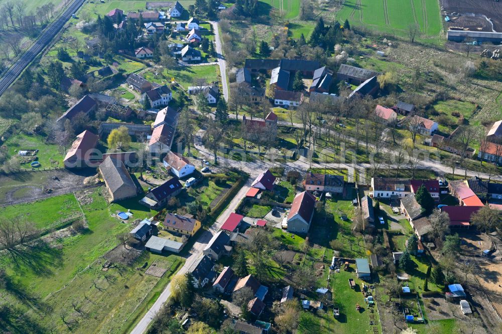 Aerial photograph Buberow - Agricultural land and field boundaries surround the settlement area of the village in Buberow in the state Brandenburg, Germany