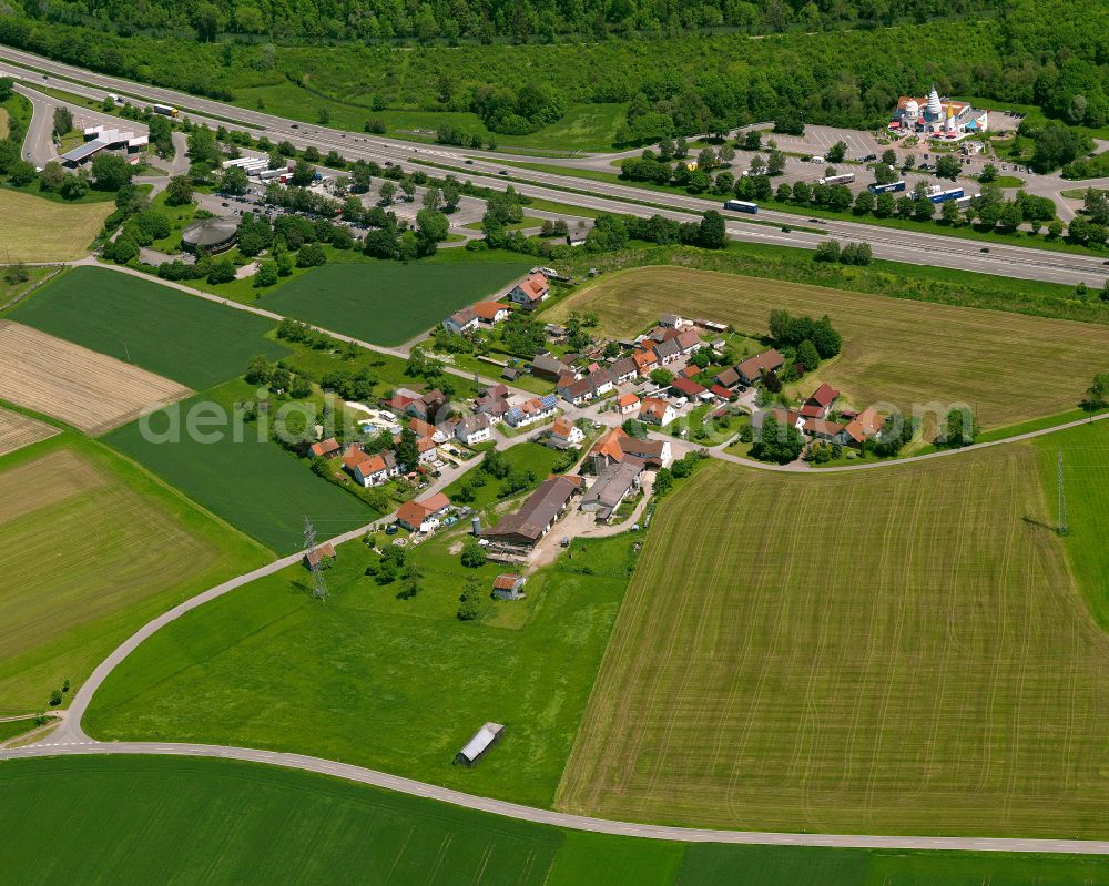 Buchau from the bird's eye view: Agricultural land and field boundaries surround the settlement area of the village in Buchau in the state Baden-Wuerttemberg, Germany