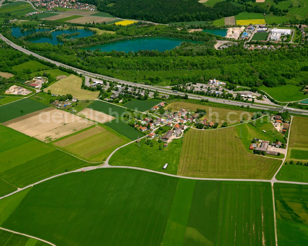 Aerial image Buchau - Agricultural land and field boundaries surround the settlement area of the village in Buchau in the state Baden-Wuerttemberg, Germany