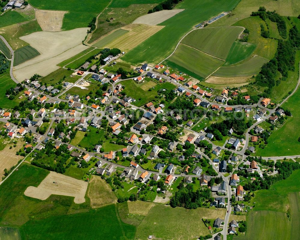 Aerial photograph Buhlenberg - Agricultural land and field boundaries surround the settlement area of the village in Buhlenberg in the state Rhineland-Palatinate, Germany