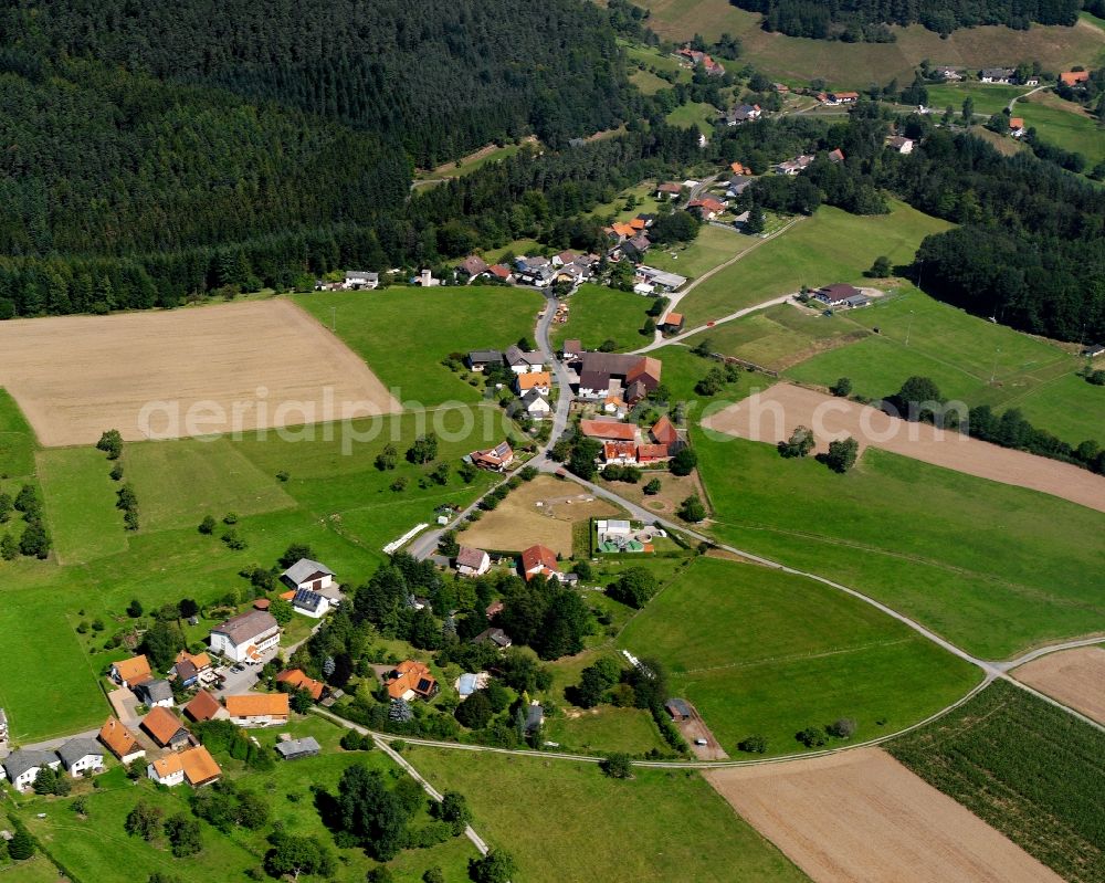 Aerial photograph Bullau - Agricultural land and field boundaries surround the settlement area of the village in Bullau in the state Hesse, Germany