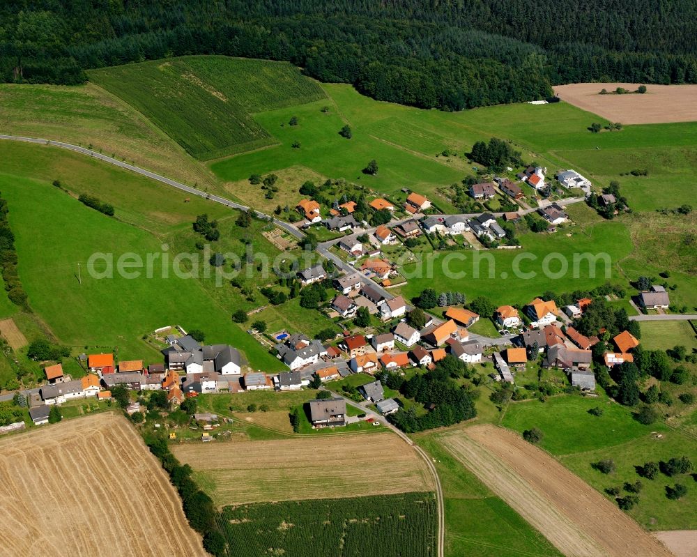 Bullau from above - Agricultural land and field boundaries surround the settlement area of the village in Bullau in the state Hesse, Germany