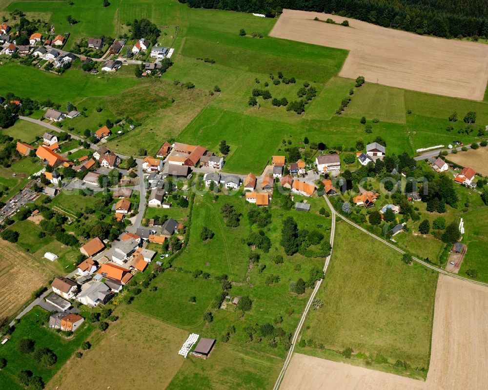 Aerial image Bullau - Agricultural land and field boundaries surround the settlement area of the village in Bullau in the state Hesse, Germany