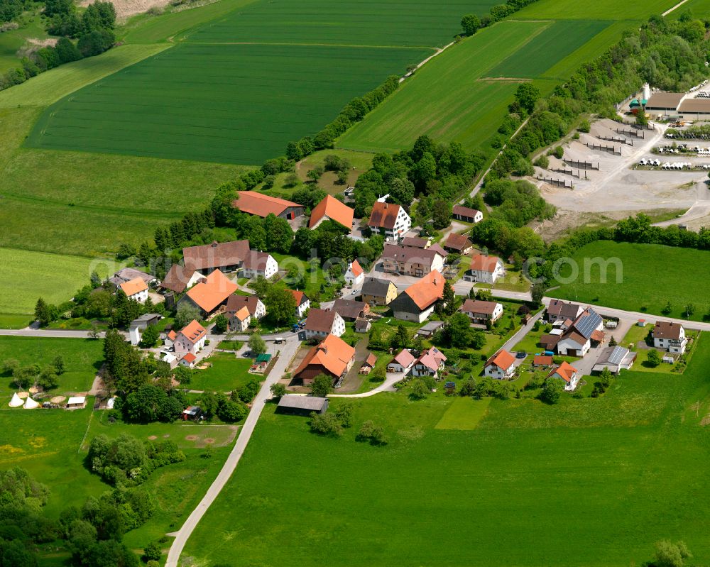 Burgau from above - Agricultural land and field boundaries surround the settlement area of the village in Burgau in the state Baden-Wuerttemberg, Germany