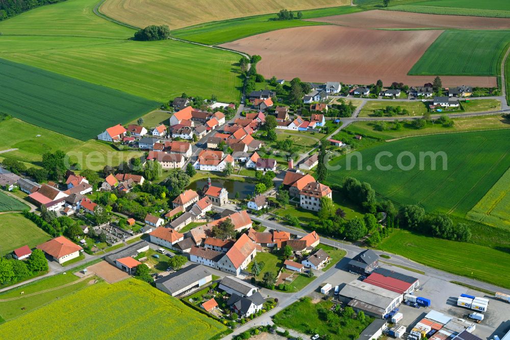 Aerial photograph Burgpreppach - Agricultural land and field boundaries surround the settlement area of the village in Burgpreppach in the state Bavaria, Germany