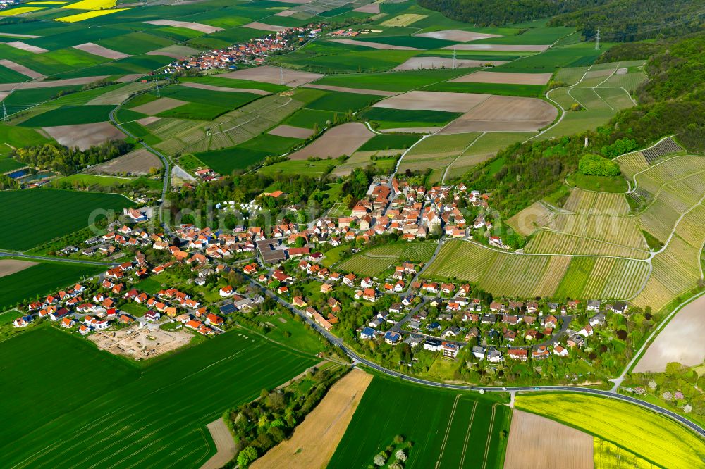 Aerial photograph Castell - Agricultural land and field boundaries surround the settlement area of the village in Castell in the state Bavaria, Germany