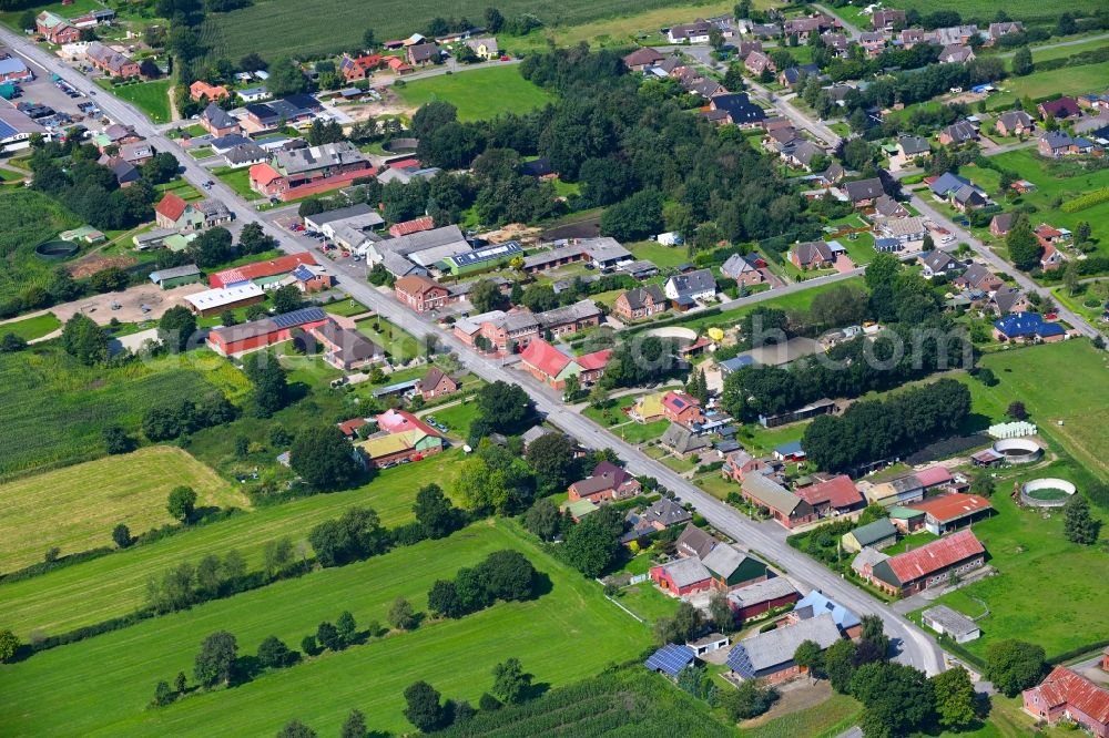 Christiansholm from above - Agricultural land and field boundaries surround the settlement area of the village in Christiansholm in the state Schleswig-Holstein, Germany