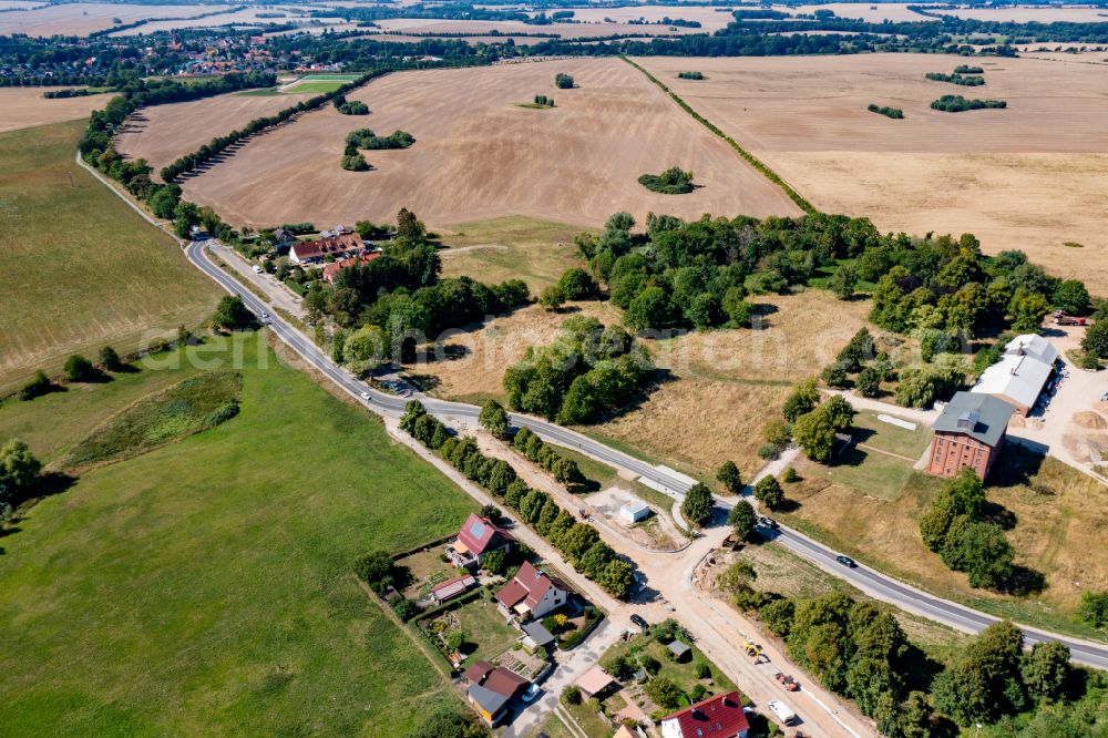 Christinenfeld from above - Agricultural land and field boundaries surround the settlement area of the village in Christinenfeld in the state Mecklenburg - Western Pomerania, Germany